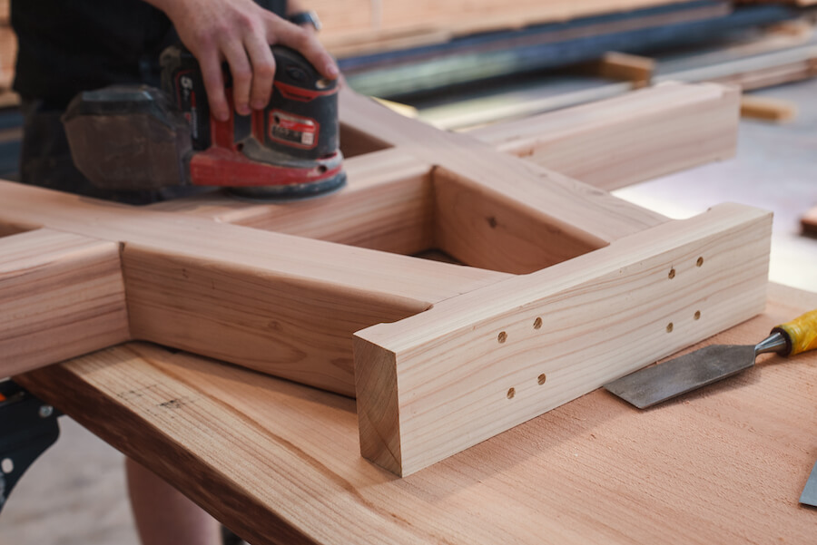 picnic bench being sanded